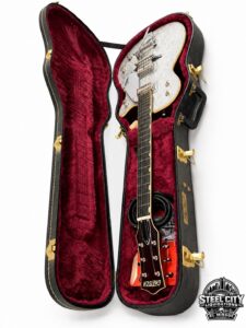 Gretsch guitar and open hard-shell case, alternate angle